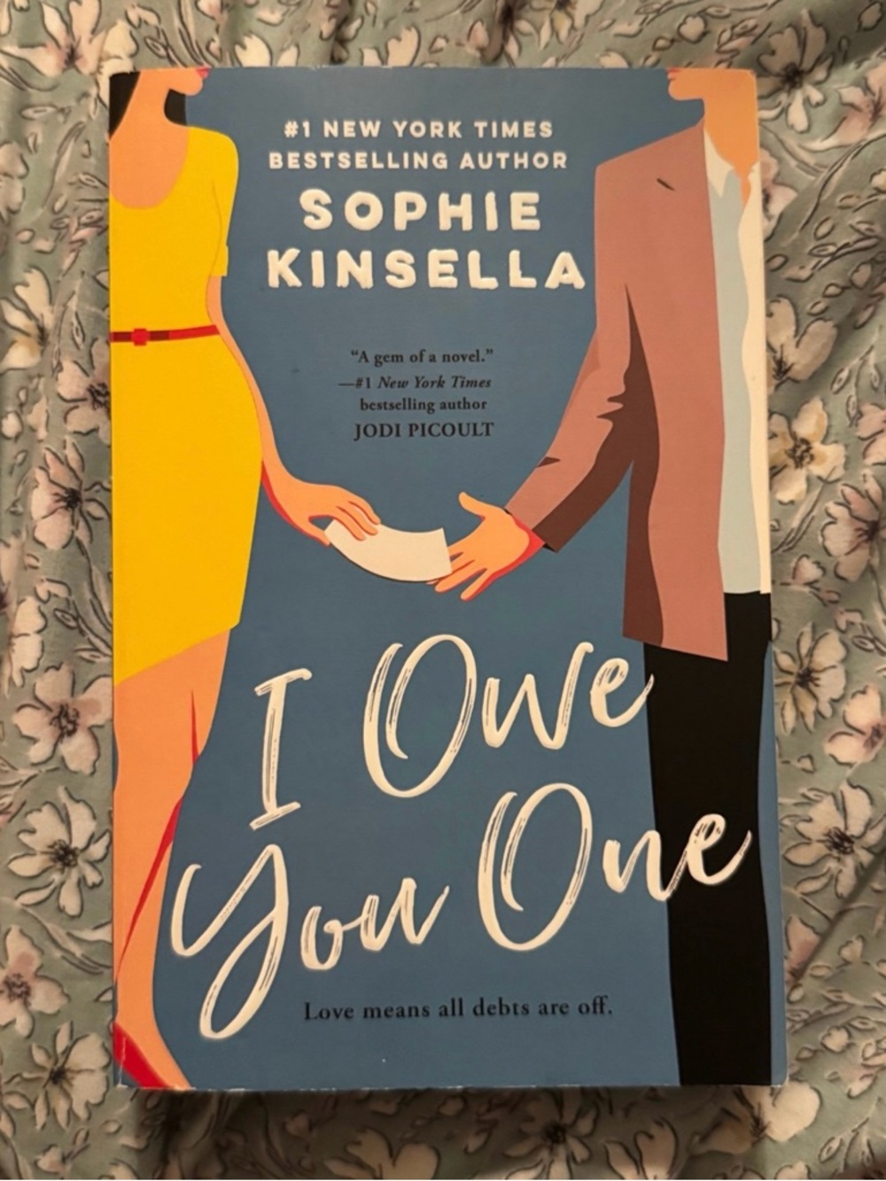 Sophie Kinsella "I Owe You One" - Blue Cover with Yellow Accents Book